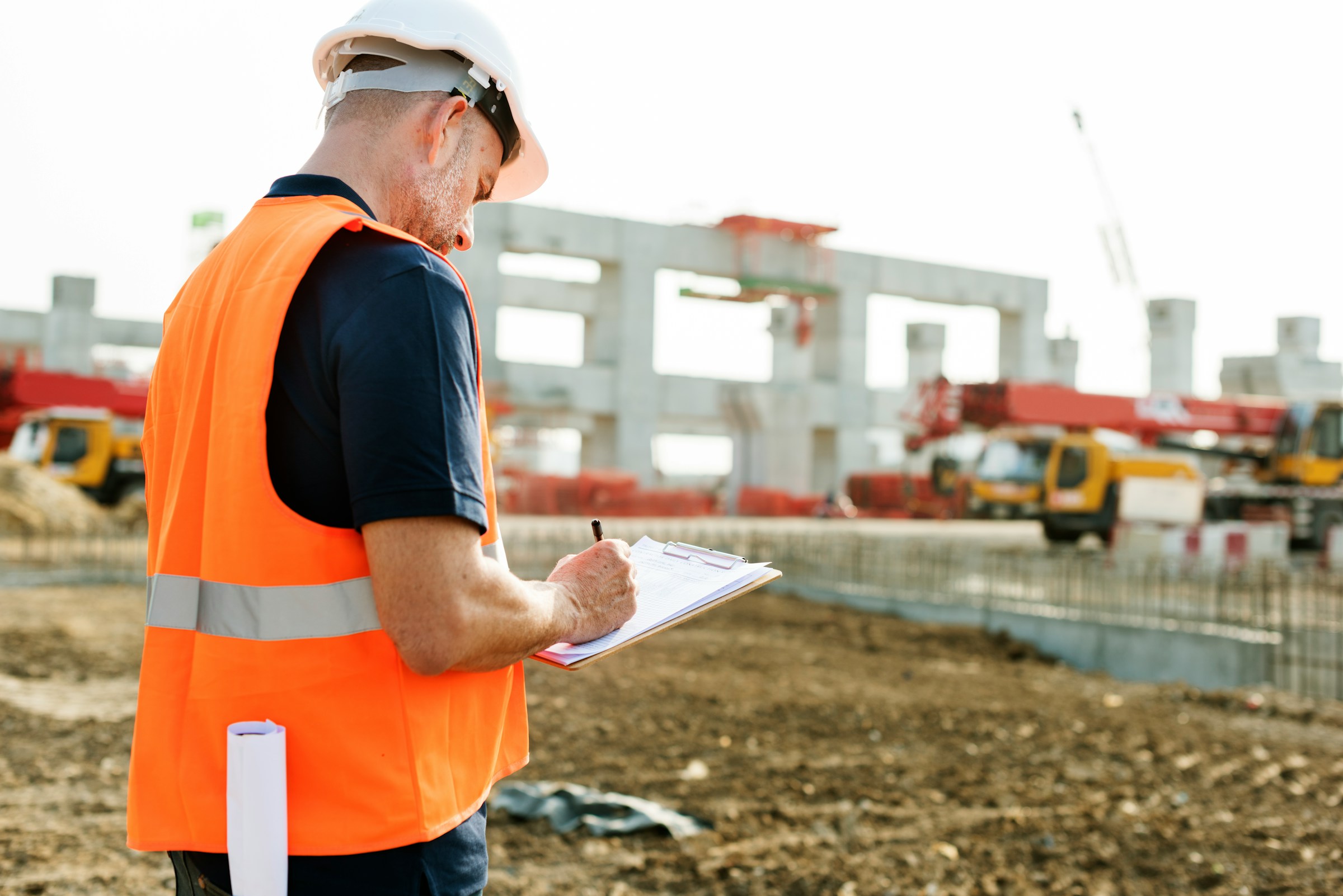 Environmental inspector documenting a site assessment