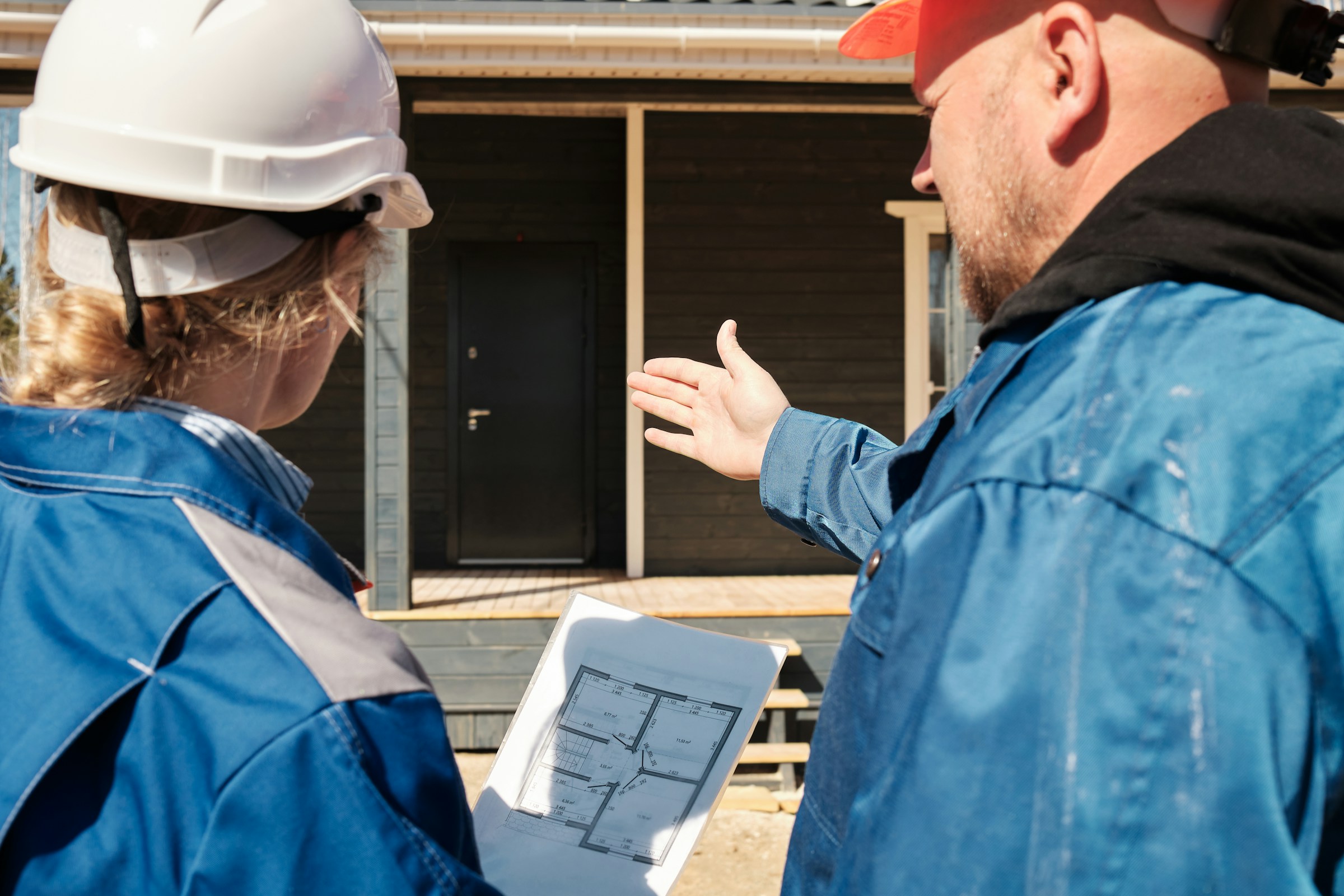 Consultants reviewing findings with a client on site